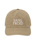 A beige washed cotton baseball cap with white embroidered text reading 'SANG FROID' on the front, shown against a plain white background.