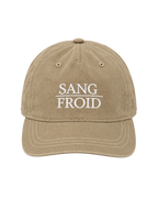 A beige washed cotton baseball cap with white embroidered text reading 'SANG FROID' on the front, shown against a plain white background.