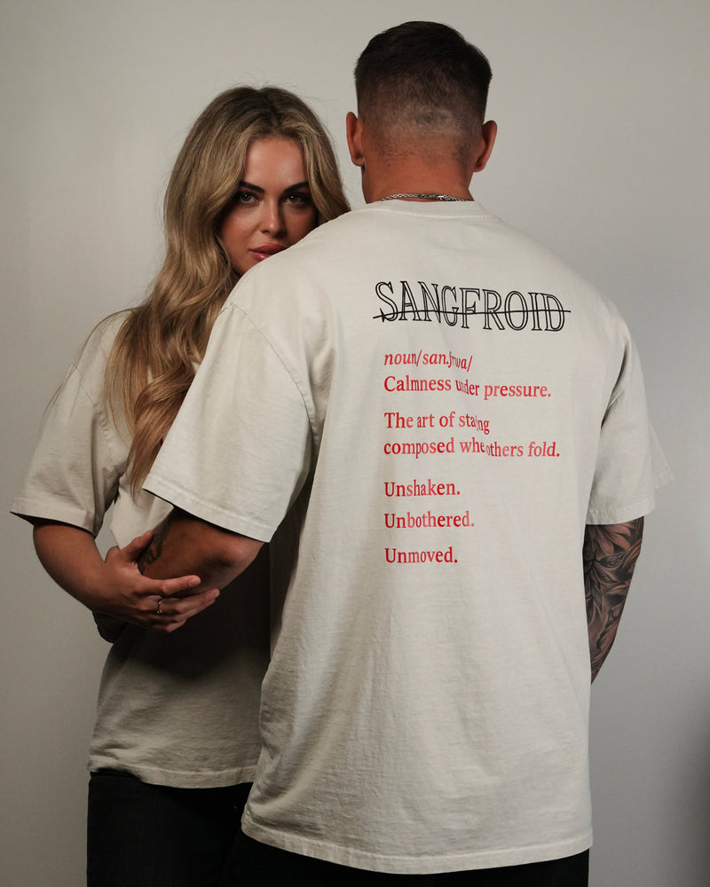 Man wearing a t-shirt with text on the back, standing next to a woman.