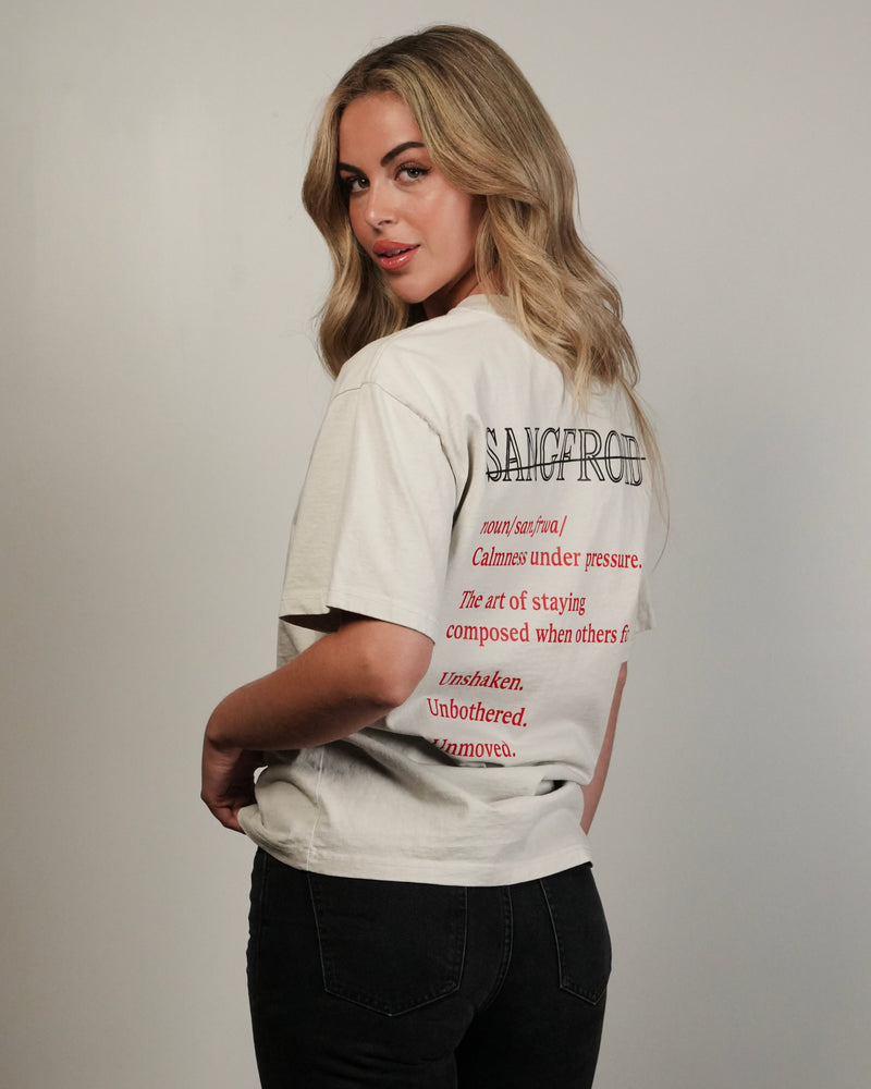 Woman wearing a white t-shirt with text on the back against a plain background