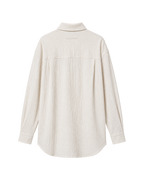 A cream-colored cotton shirt with a mock neck collar, shown from the back on a solid white background.